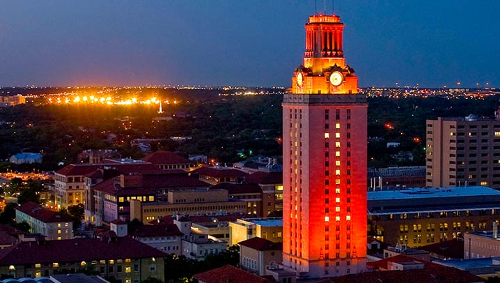 The University of Texas tower with windows lit up displaying the number 1